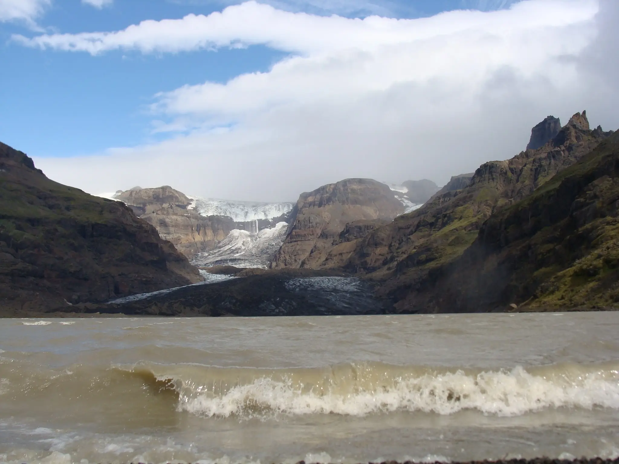 Waves on glacier lagoon at the foot of Morsárdalsjökull in Morsárdalur valley by photographer Gudrun