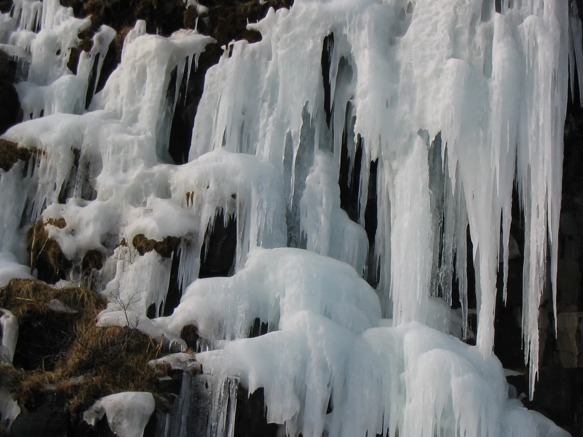 Frosen water at Svartifoss during winter by photographer Gudrun