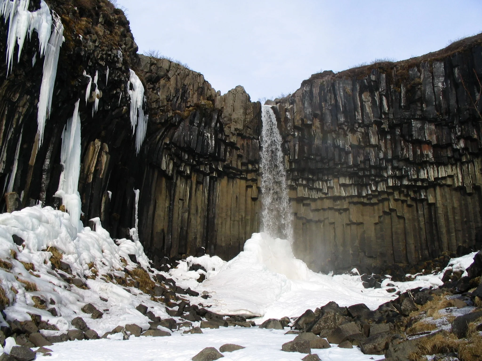 Svartifoss in snowy landscape during winter by photographer Gudrun